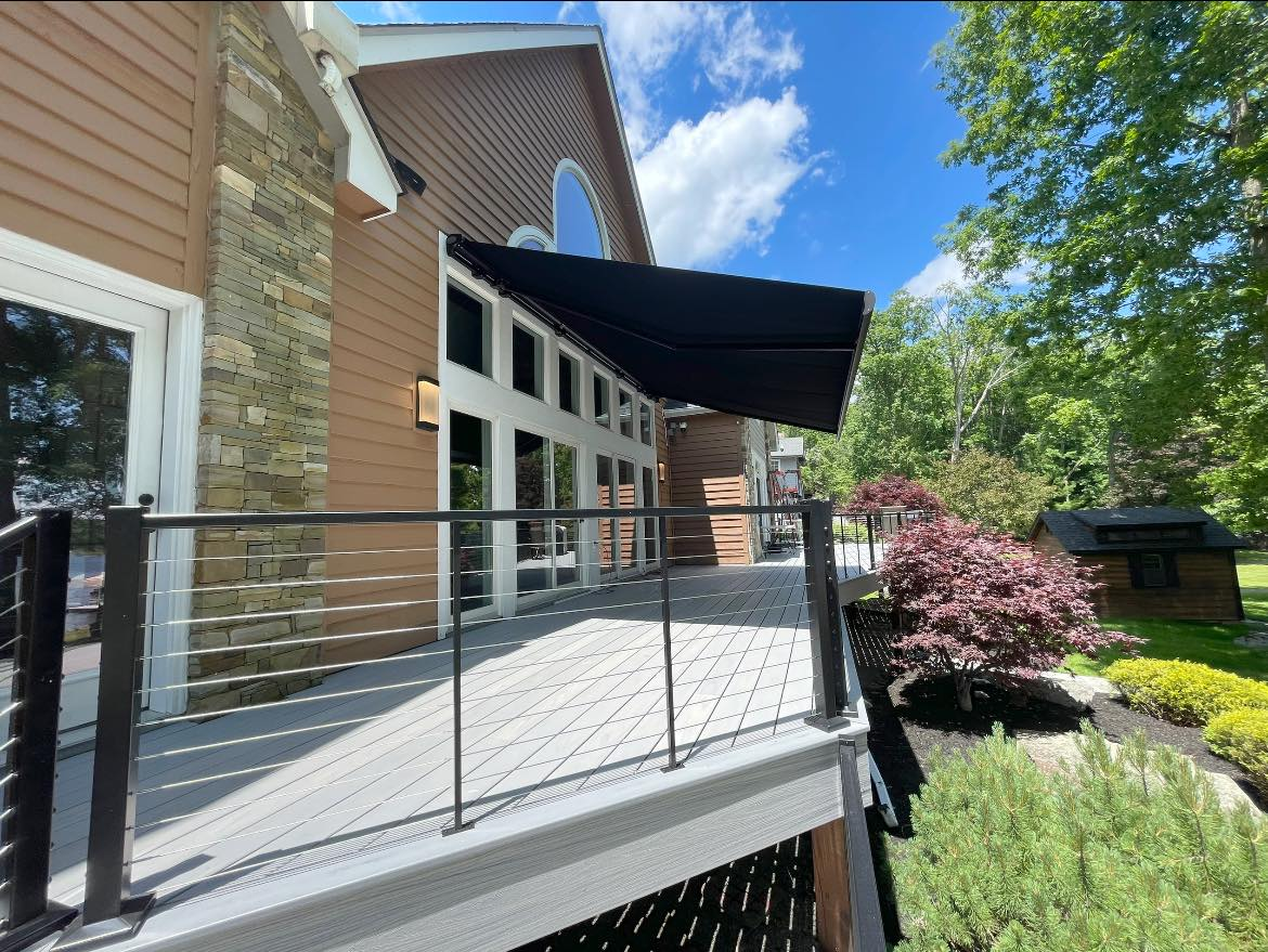 retractable canvas awning installed over top of back deck by Country Canvas awnings view 1