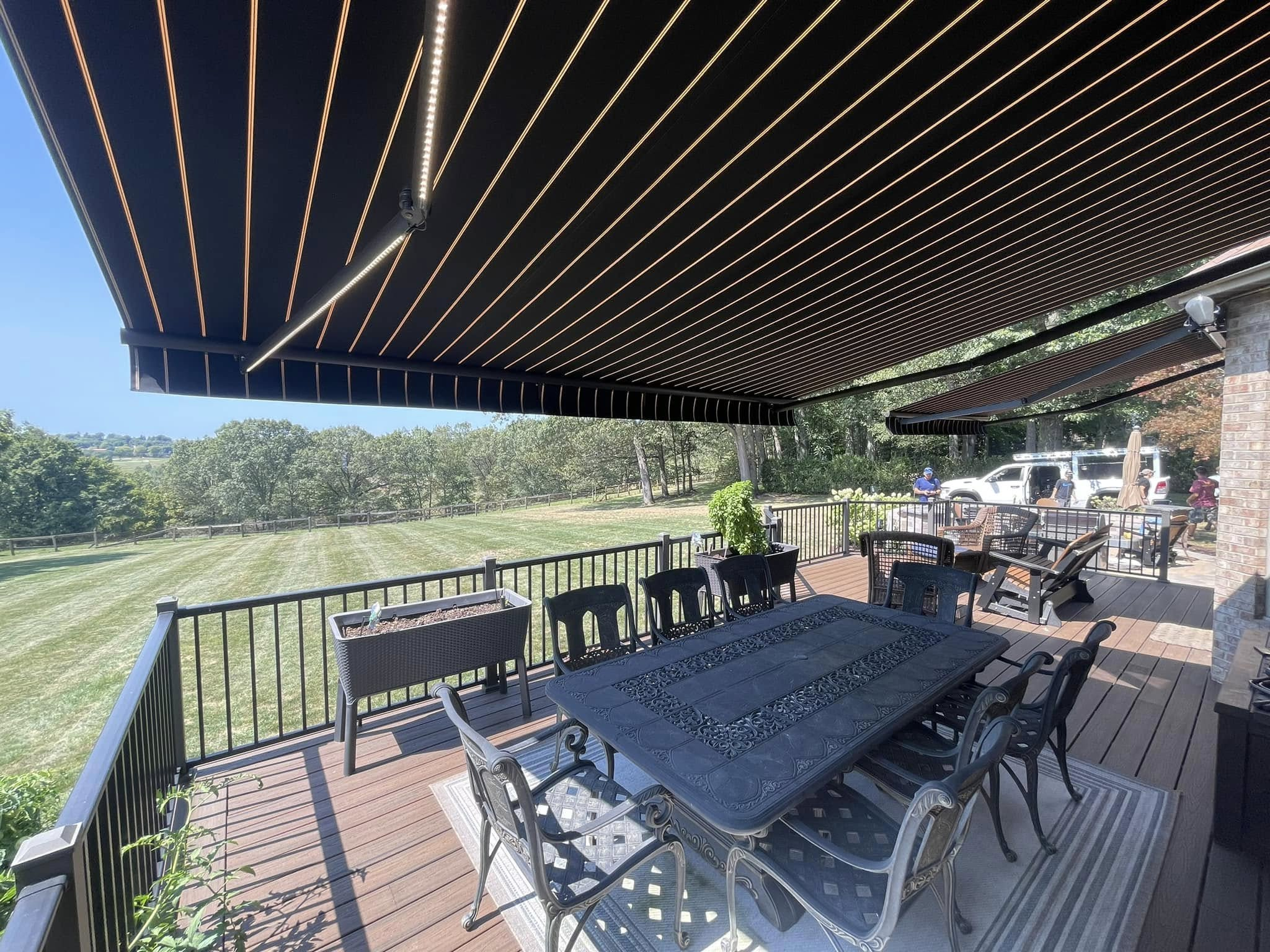 retractable canvas awning installed over rear deck by Country Canvas Awnings