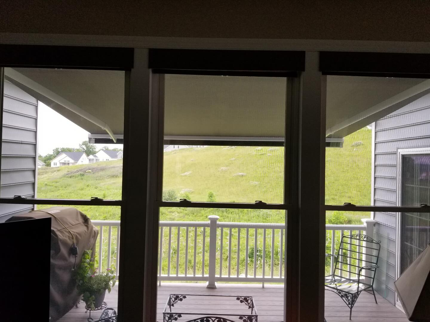 view of retractable awning from inside the house
