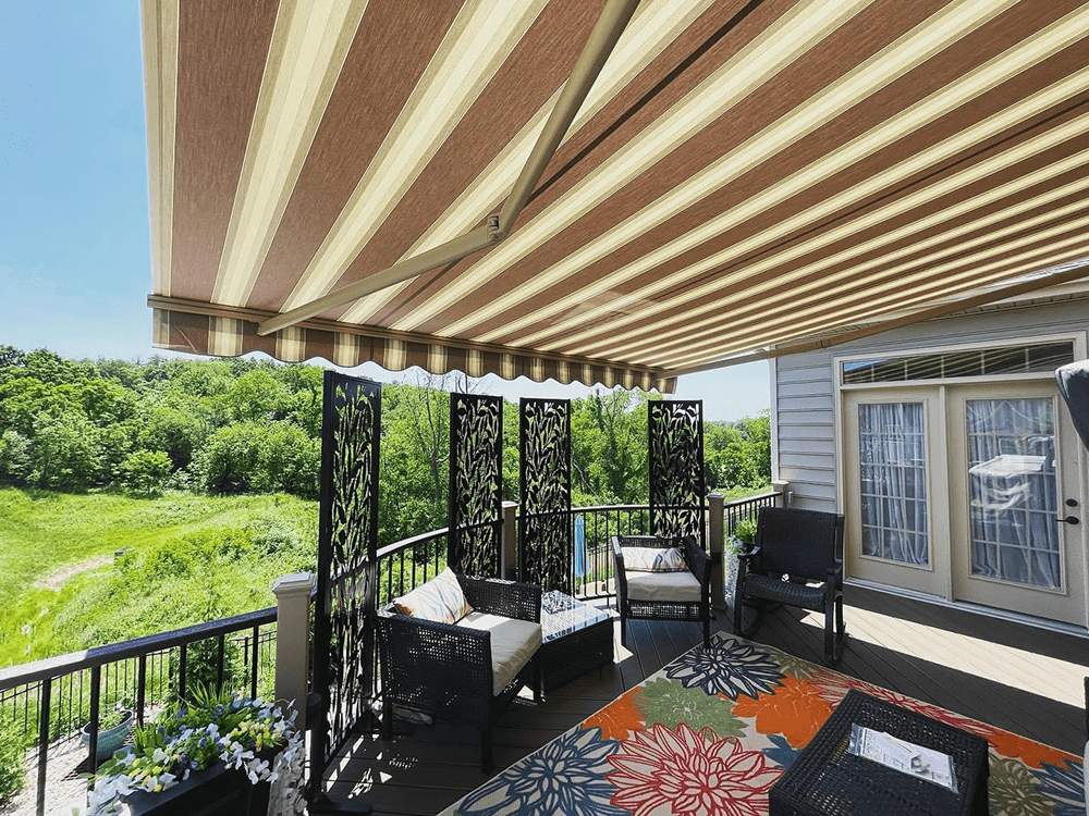 retractable canvas awning stretched out over a back deck, installed by Country Canvas awnings