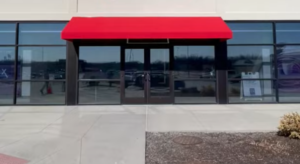 Commercial awning on Xfinity storefront by Country Canvas Awnings