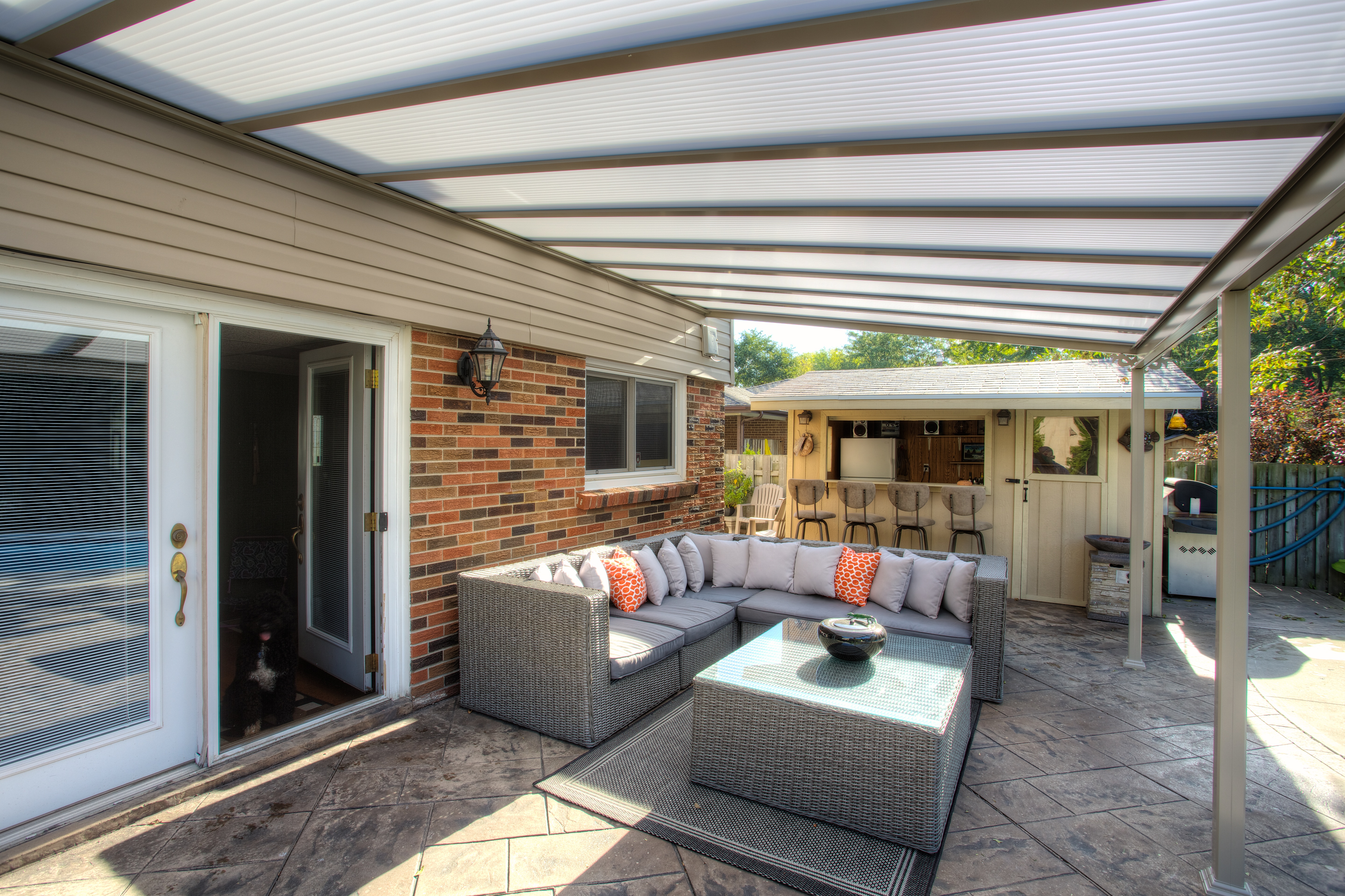 clear patio roof installed on top of outdoor patio