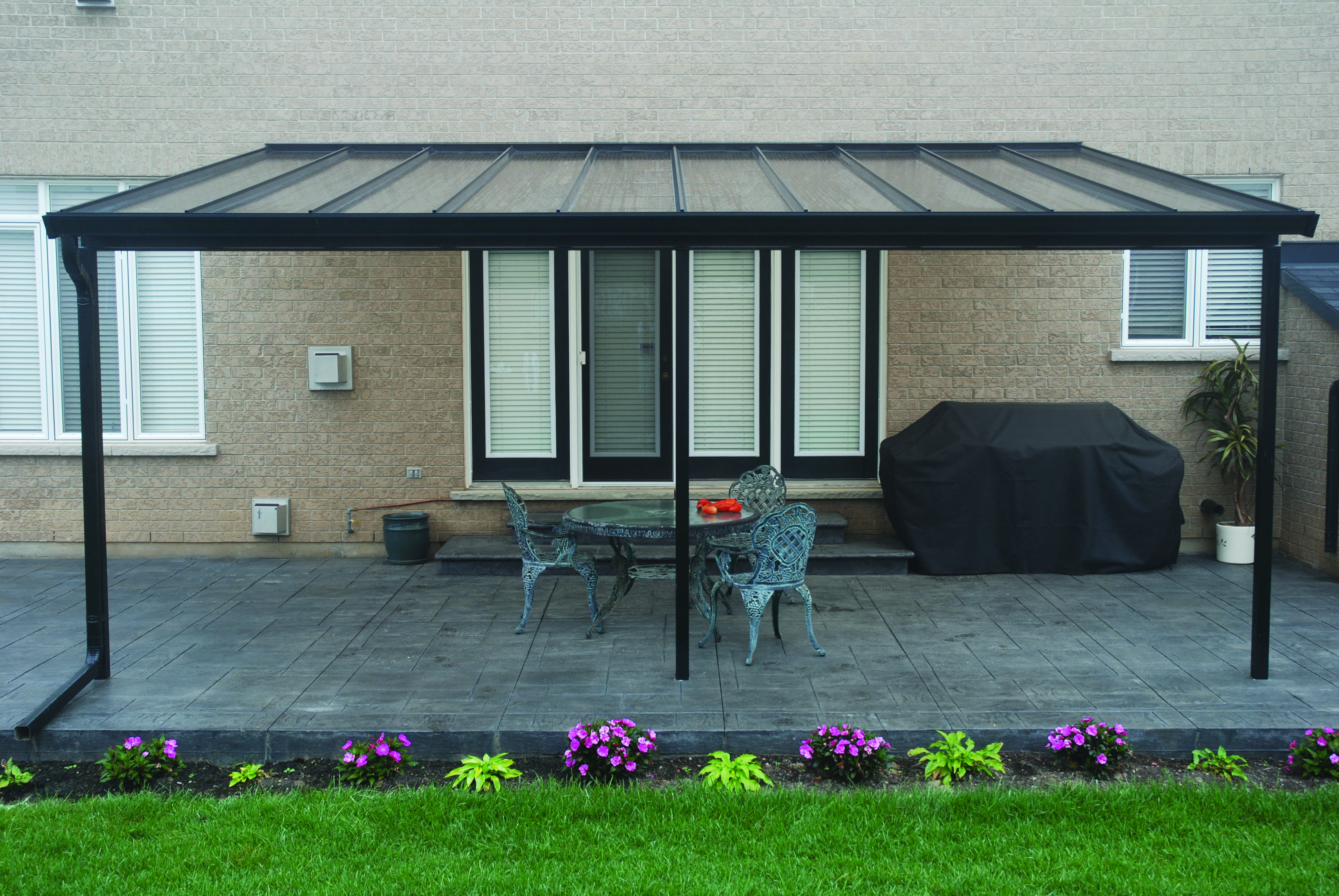 clear patio cover with aluminum frame that matches window frame color
